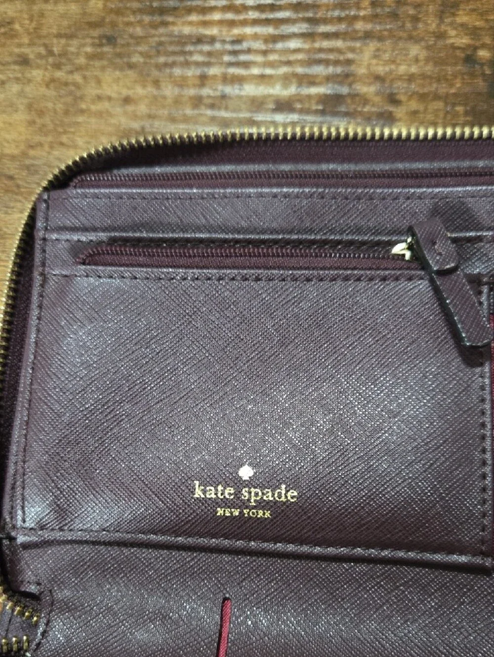 kate spade deep plum Saffiano zip-around leather wallet